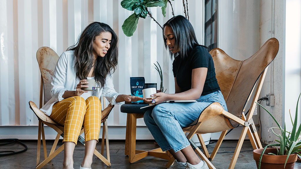 Women talking in modern office