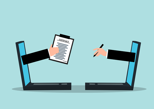 A person handing a digital contract to the person who has to sign it