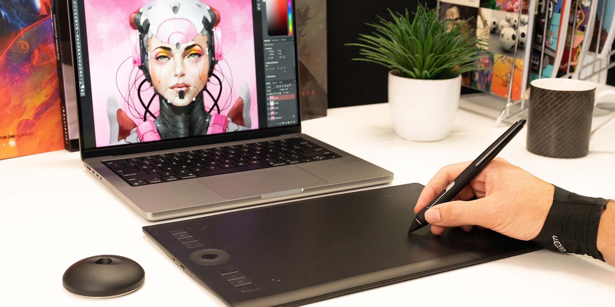 User creating art on Wacom Intuos Pro with glove