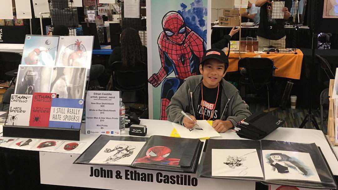 Young Ethan tabling at a comic convention