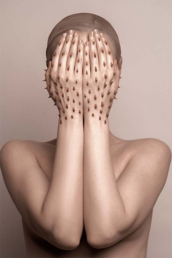 Flora Borsi photo art person with spikes on their hands