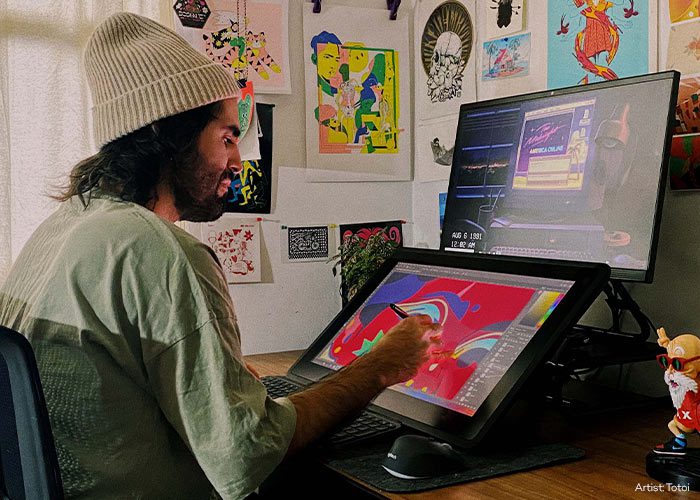 Criador usando um monitor interativo Wacom Cintiq Pro 24